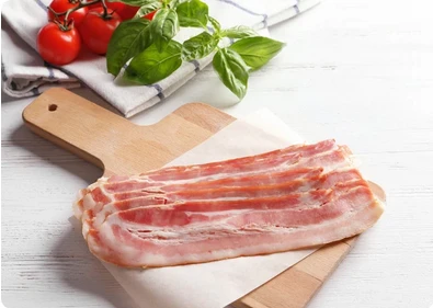 Bacon rashers on a wooden board