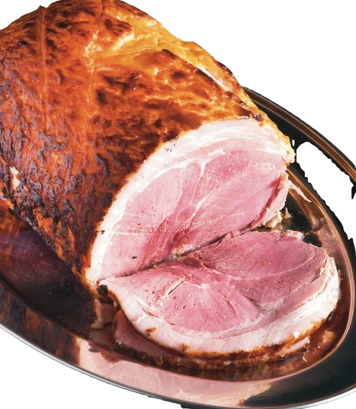 Sliced smoked ham on a wooden board