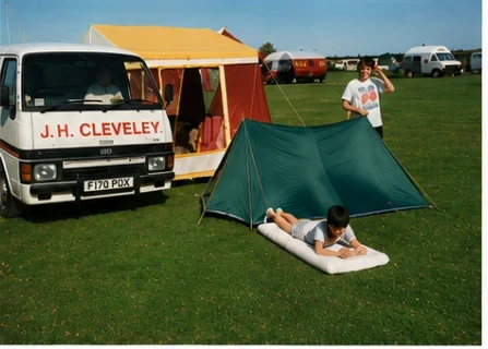 A J. H. Cleveley van beside a family tent